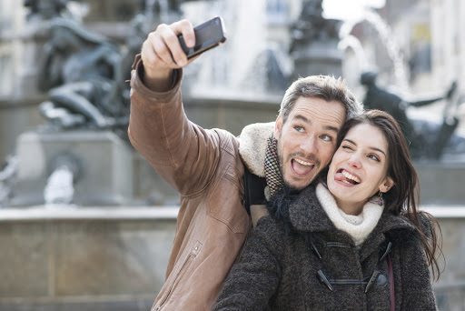Young couple taking a selfie of their grimaces &#8211; pt