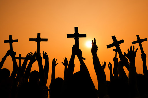 Crosses held up at sunset &#8211; pt