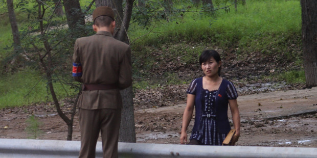web3-north-korea-woman-police-checkpoint-control-roman-harak-cc