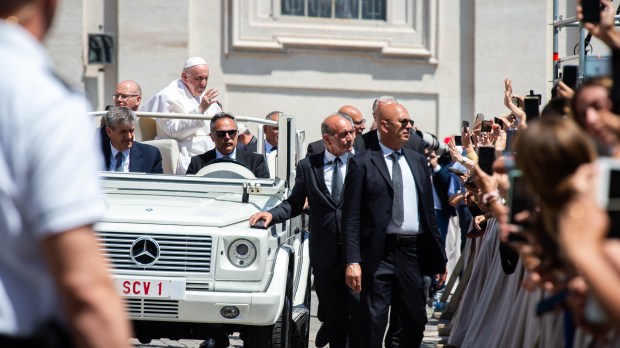 Pope Francis blesses faithful as he leaves St. Peter's square on the Popemobile