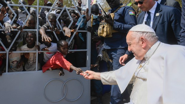 Outside-the-cathedral-of-Juba-a-child-gives-the-Pope-a-banknote-Vatican-Media