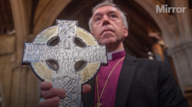 Archbishop Andrew John of the Church in Wales, holding Cross of Wales