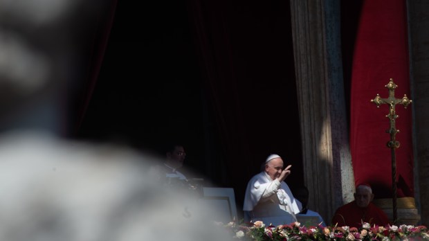 Pope Francis reads the Easter Urbi et Orbi message for Easter from the loggia of St. Peter's basilica
