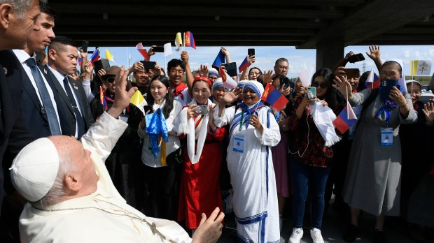 people greeting Pope Francis upon his arrival at the Apostolic Prefecture of Ulaanbaatar